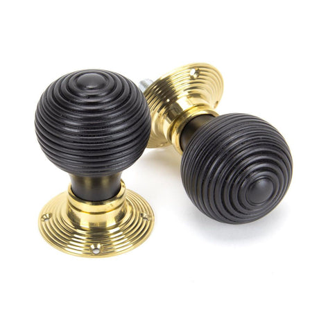 This is an image of From The Anvil - Ebony & Polished Brass Beehive Mortice/Rim Knob Set available to order from T.H Wiggans Architectural Ironmongery in Kendal, quick delivery and discounted prices.