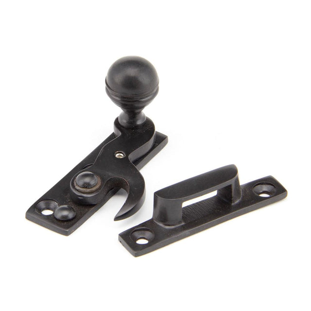 This is an image showing From The Anvil - Aged Bronze Prestbury Sash Hook Fastener available from T.H Wiggans Architectural Ironmongery in Kendal, quick delivery and discounted prices