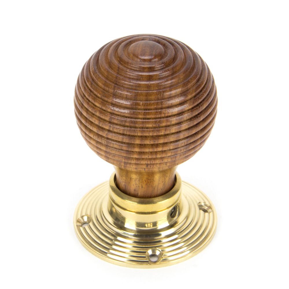 This is an image showing From The Anvil - Rosewood & Polished Brass Beehive Mortice/Rim Knob Set available from trade door handles, quick delivery and discounted prices