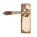 This is an image of From The Anvil - Polished Bronze Reeded Lever Lock Set available to order from T.H Wiggans Architectural Ironmongery in Kendal, quick delivery and discounted prices.