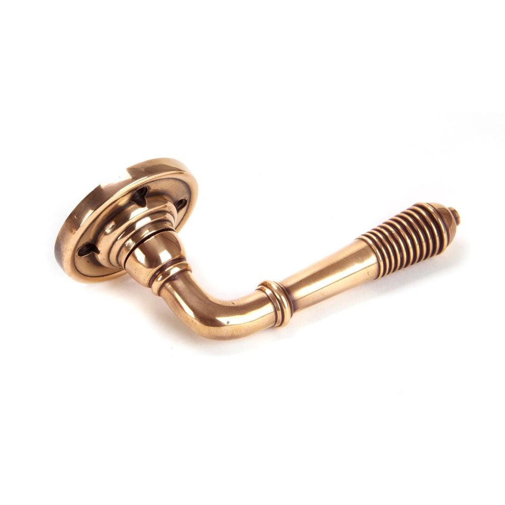 This is an image of From The Anvil - Polished Bronze Reeded Lever on Rose Set available to order from T.H Wiggans Architectural Ironmongery in Kendal, quick delivery and discounted prices.