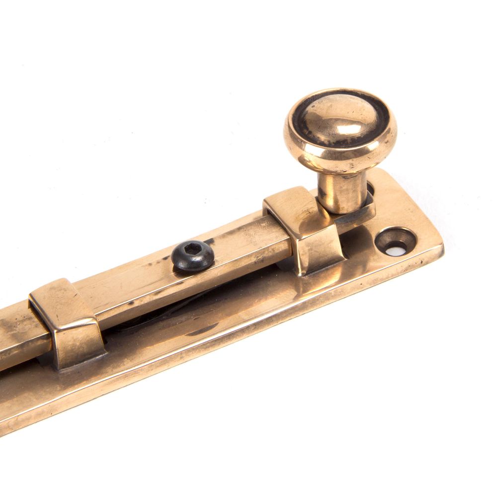 This is an image showing From The Anvil - Polished Bronze 4" Universal Bolt available from trade door handles, quick delivery and discounted prices