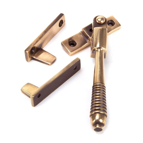 This is an image showing From The Anvil - Polished Bronze Night-Vent Locking Reeded Fastener available from T.H Wiggans Architectural Ironmongery in Kendal, quick delivery and discounted prices