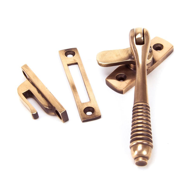 This is an image showing From The Anvil - Polished Bronze Locking Reeded Fastener available from T.H Wiggans Architectural Ironmongery in Kendal, quick delivery and discounted prices