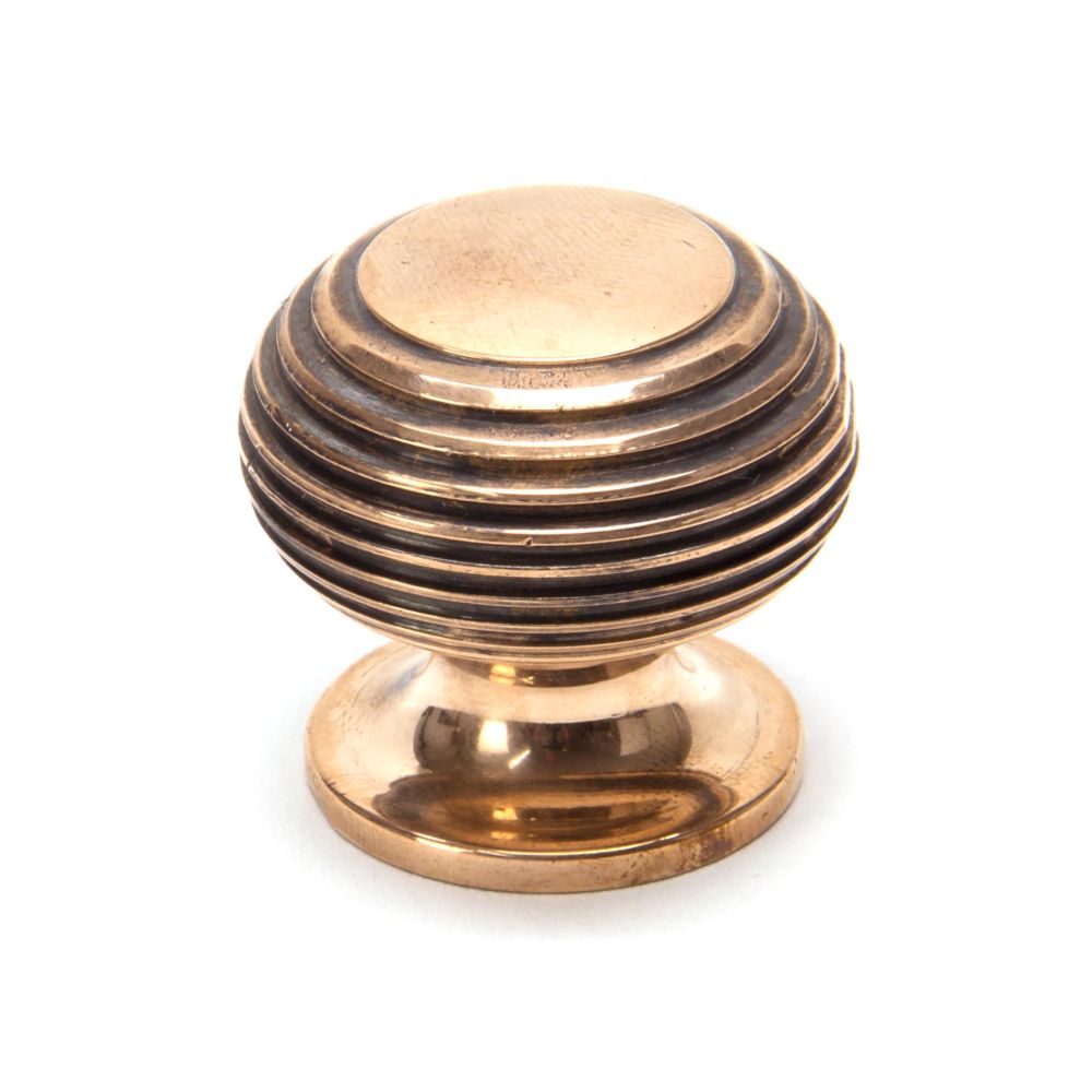 This is an image showing From The Anvil - Polished Bronze Beehive Cabinet Knob 30mm available from T.H Wiggans Architectural Ironmongery in Kendal, quick delivery and discounted prices