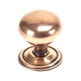 This is an image showing From The Anvil - Polished Bronze Mushroom Cabinet Knob 38mm available from T.H Wiggans Architectural Ironmongery in Kendal, quick delivery and discounted prices