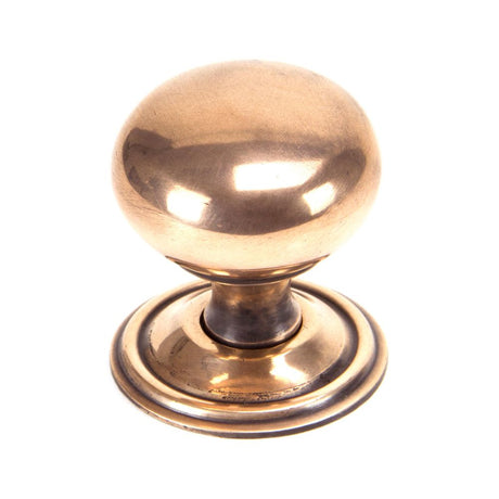 This is an image showing From The Anvil - Polished Bronze Mushroom Cabinet Knob 38mm available from T.H Wiggans Architectural Ironmongery in Kendal, quick delivery and discounted prices