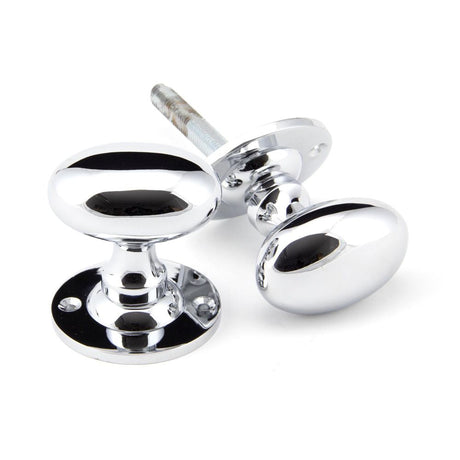 This is an image of From The Anvil - Polished Chrome Oval Mortice/Rim Knob Set available to order from T.H Wiggans Architectural Ironmongery in Kendal, quick delivery and discounted prices.