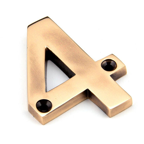 This is an image of From The Anvil - Polished Bronze Numeral 4 available to order from T.H Wiggans Architectural Ironmongery in Kendal, quick delivery and discounted prices.