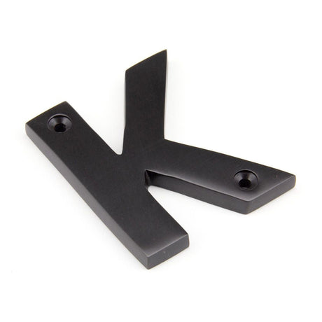 This is an image of From The Anvil - Aged Bronze Letter K available to order from T.H Wiggans Architectural Ironmongery in Kendal, quick delivery and discounted prices.