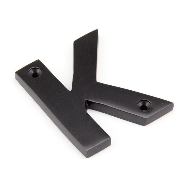 This is an image of From The Anvil - Aged Bronze Letter K available to order from T.H Wiggans Architectural Ironmongery in Kendal, quick delivery and discounted prices.