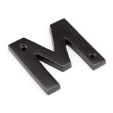 This is an image of From The Anvil - Aged Bronze Letter M available to order from T.H Wiggans Architectural Ironmongery in Kendal, quick delivery and discounted prices.