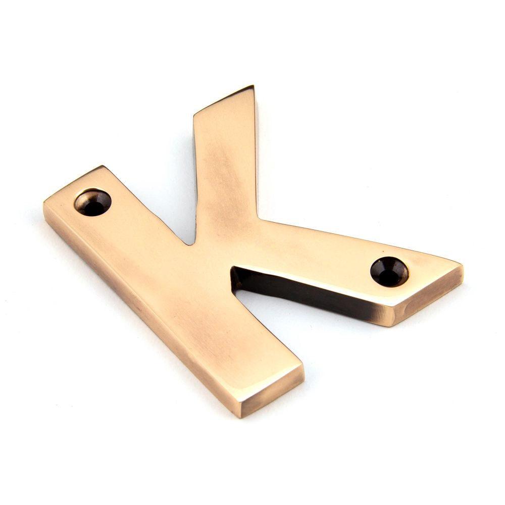 This is an image of From The Anvil - Polished Bronze Letter K available to order from T.H Wiggans Architectural Ironmongery in Kendal, quick delivery and discounted prices.