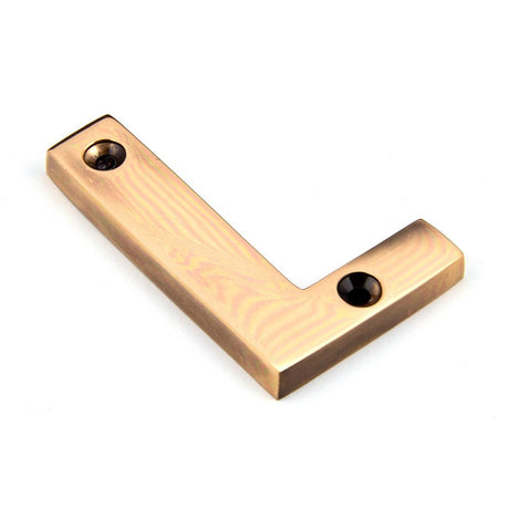This is an image of From The Anvil - Polished Bronze Letter L available to order from T.H Wiggans Architectural Ironmongery in Kendal, quick delivery and discounted prices.