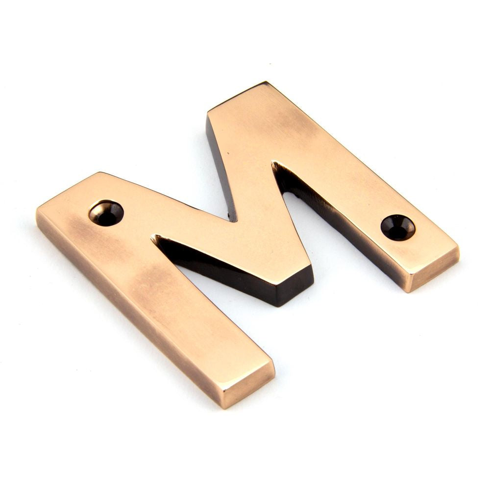 This is an image of From The Anvil - Polished Bronze Letter M available to order from T.H Wiggans Architectural Ironmongery in Kendal, quick delivery and discounted prices.