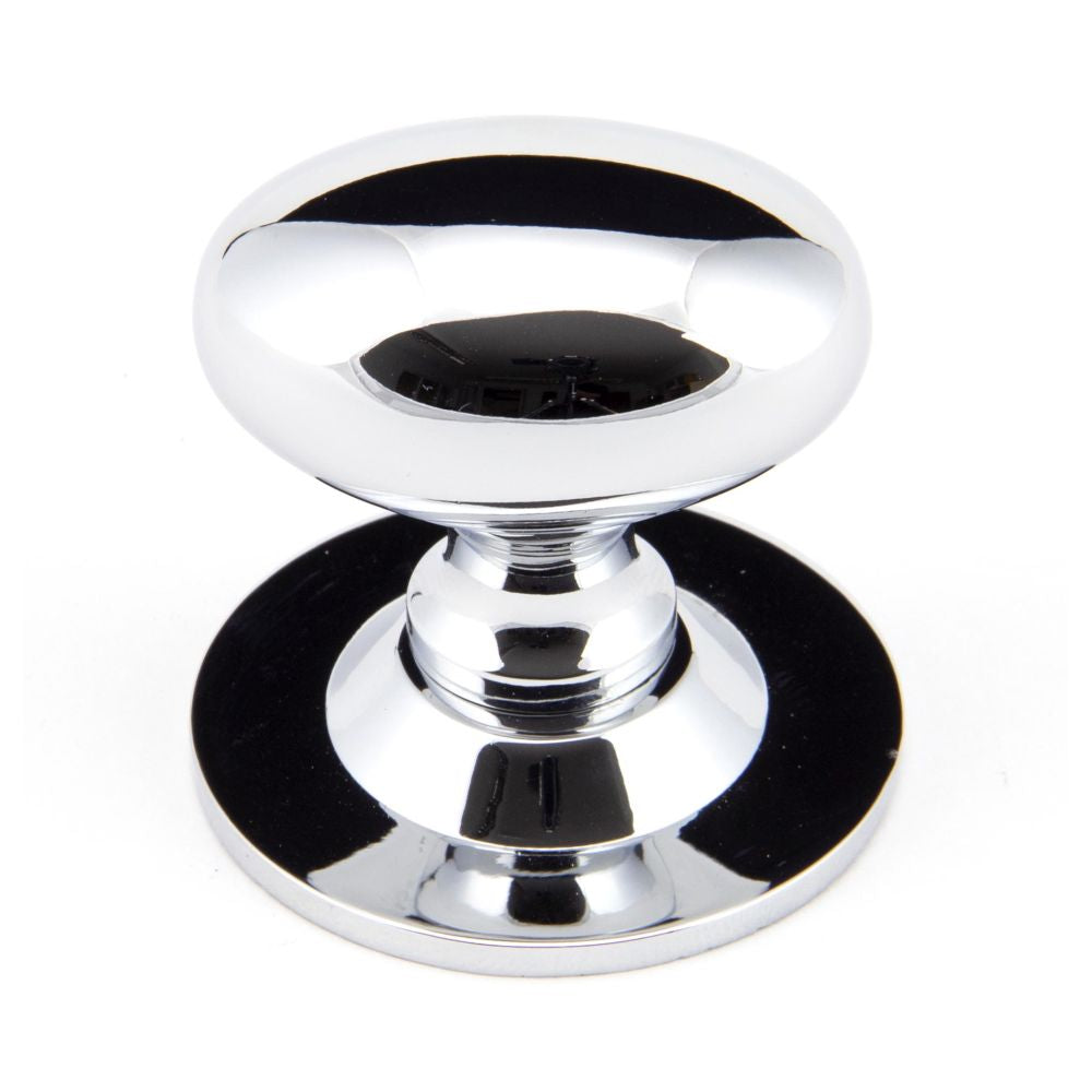This is an image showing From The Anvil - Polished Chrome Oval Cabinet Knob 40mm available from T.H Wiggans Architectural Ironmongery in Kendal, quick delivery and discounted prices