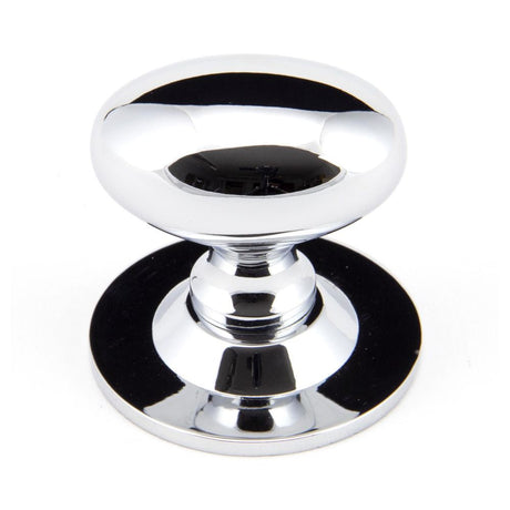 This is an image showing From The Anvil - Polished Chrome Oval Cabinet Knob 40mm available from T.H Wiggans Architectural Ironmongery in Kendal, quick delivery and discounted prices