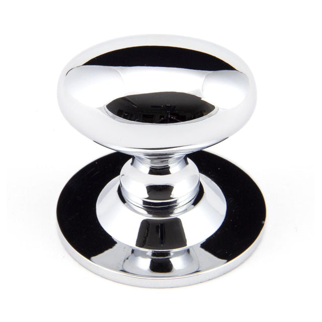 This is an image showing From The Anvil - Polished Chrome Oval Cabinet Knob 40mm available from T.H Wiggans Architectural Ironmongery in Kendal, quick delivery and discounted prices