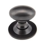 This is an image showing From The Anvil - Aged Bronze Oval Cabinet Knob 33mm available from T.H Wiggans Architectural Ironmongery in Kendal, quick delivery and discounted prices