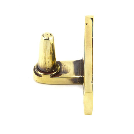 This is an image showing From The Anvil - Aged Brass Cranked Stay Pin available from T.H Wiggans Architectural Ironmongery in Kendal, quick delivery and discounted prices