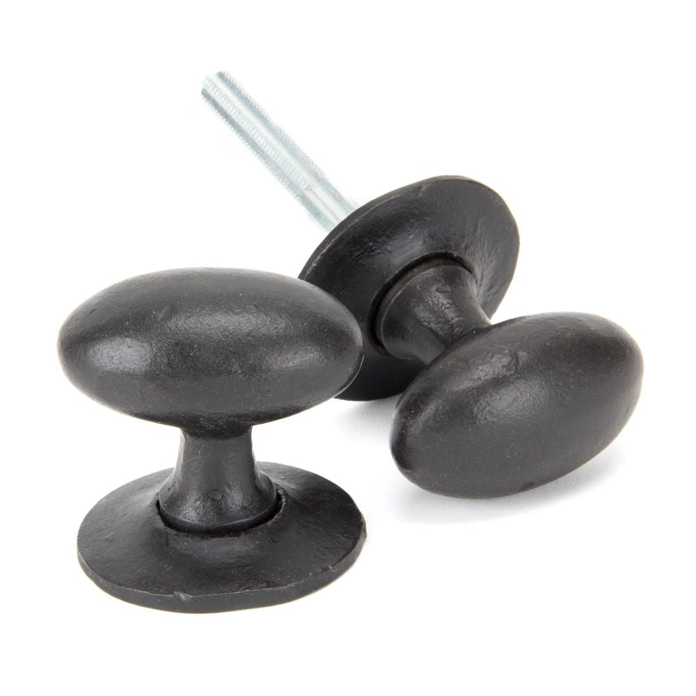 This is an image showing From The Anvil - External Beeswax Oval Mortice/Rim Knob Set available from trade door handles, quick delivery and discounted prices