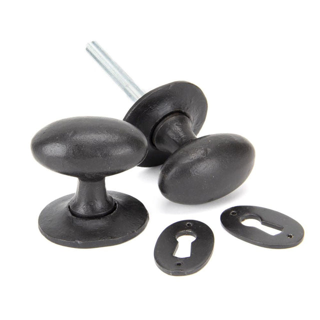 This is an image of From The Anvil - External Beeswax Oval Mortice/Rim Knob Set available to order from T.H Wiggans Architectural Ironmongery in Kendal, quick delivery and discounted prices.