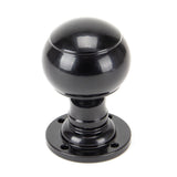 This is an image showing From The Anvil - Black Regency Mortice/Rim Knob Set available from trade door handles, quick delivery and discounted prices