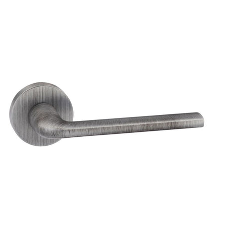 This is an image of Forme Milly Designer Lever on Minimal Round Rose - Urban Graphite available to order from T.H Wiggans Architectural Ironmongery in Kendal, quick delivery and discounted prices.
