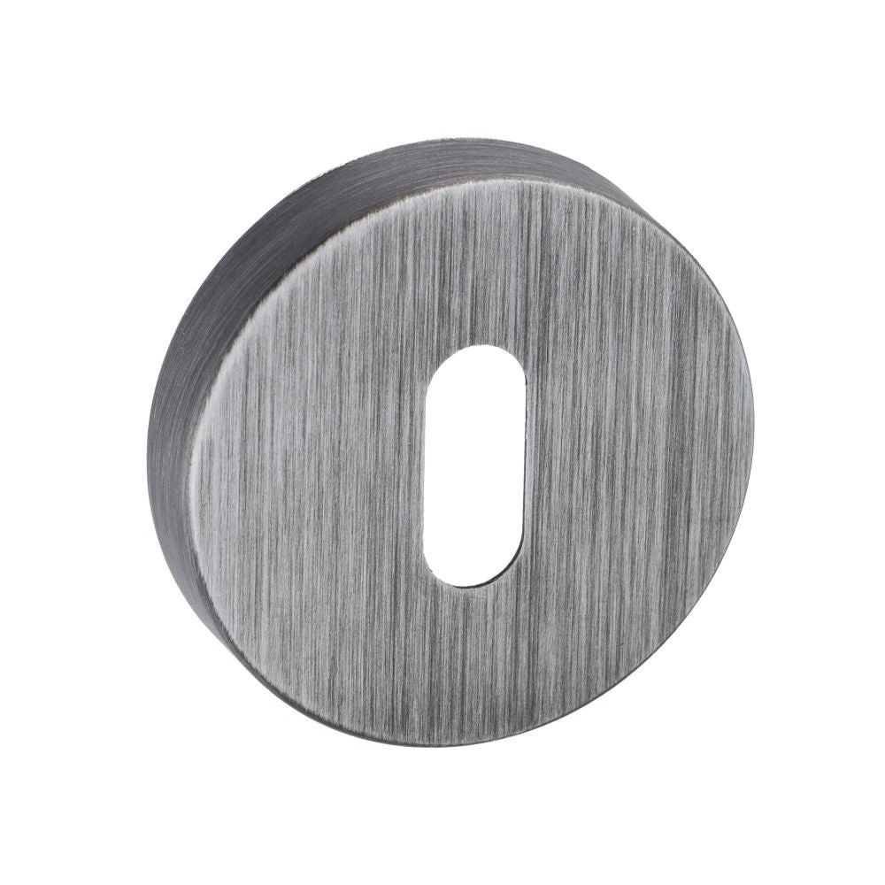 This is an image of Forme Key Escutcheon on Minimal Round Rose - Urban Graphite available to order from T.H Wiggans Architectural Ironmongery in Kendal, quick delivery and discounted prices.