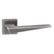 This is an image of Forme Naxos Designer Lever on Minimal Square Rose - Urban Graphite available to order from T.H Wiggans Architectural Ironmongery in Kendal, quick delivery and discounted prices.