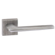 This is an image of Forme Boston Designer Lever on Minimal Square Rose - Urban Graphite available to order from T.H Wiggans Architectural Ironmongery in Kendal, quick delivery and discounted prices.
