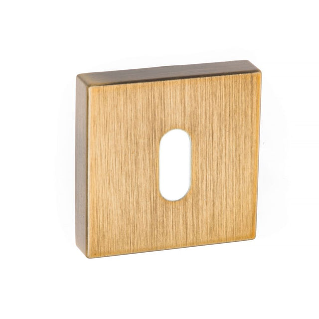 This is an image of Forme Key Escutcheon on Minimal Square Rose - Yester Bronze available to order from T.H Wiggans Architectural Ironmongery in Kendal, quick delivery and discounted prices.