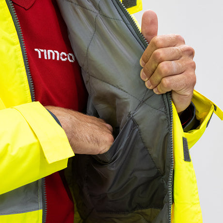 This is an image showing TIMCO Hi-Visibility Parka Jacket - Yellow - XXXX Large - 1 Each Bag available from T.H Wiggans Ironmongery in Kendal, quick delivery at discounted prices.