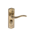 This is an image of Old English Warwick WC Lever on Backplate - Antique Brass available to order from T.H Wiggans Architectural Ironmongery in Kendal, quick delivery and discounted prices.