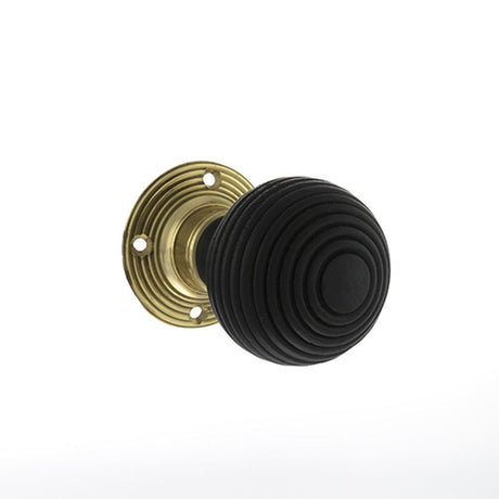 This is an image of Old English Whitby Ebony Wood Reeded Mortice Knob on 60mm Face Fix Rose - Polish available to order from T.H Wiggans Architectural Ironmongery in Kendal, quick delivery and discounted prices.