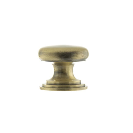 This is an image of Old English Lincoln Solid Brass Cabinet Knob 32mm Concealed Fix - Ant. Brass available to order from T.H Wiggans Architectural Ironmongery in Kendal.