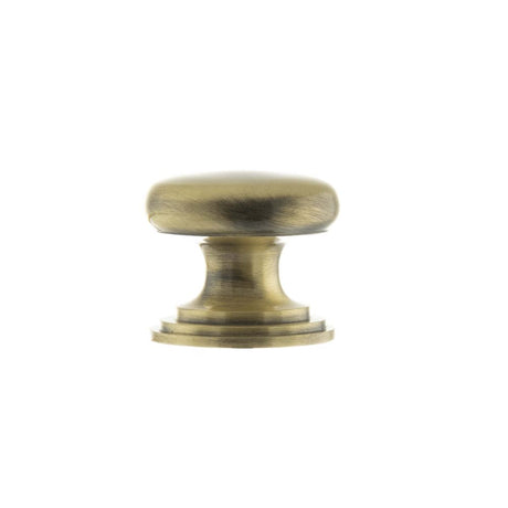 This is an image of Old English Lincoln Solid Brass Cabinet Knob 32mm Concealed Fix - Ant. Brass available to order from Trade Door Handles.
