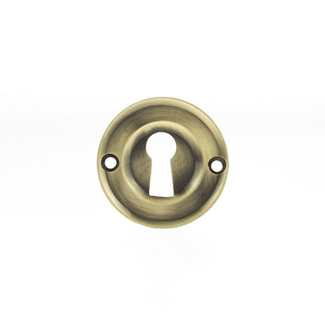 This is an image of Old English Solid Brass Open Key Hole Escutcheon - Antique Brass available to order from T.H Wiggans Architectural Ironmongery in Kendal, quick delivery and discounted prices.