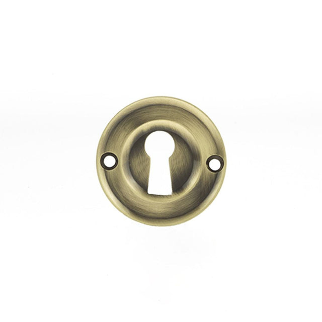 This is an image of Old English Solid Brass Open Key Hole Escutcheon - Antique Brass available to order from T.H Wiggans Architectural Ironmongery in Kendal, quick delivery and discounted prices.