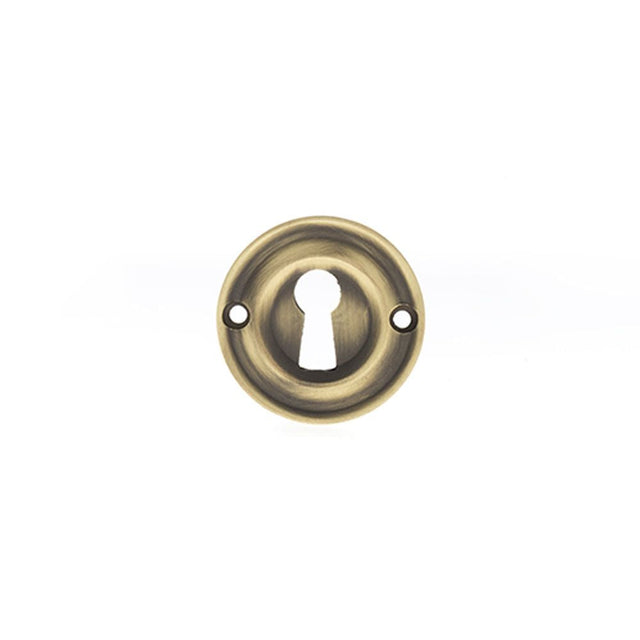 This is an image of Old English Solid Brass Open Key Hole Escutcheon - Matt Antique Brass available to order from T.H Wiggans Architectural Ironmongery in Kendal, quick delivery and discounted prices.