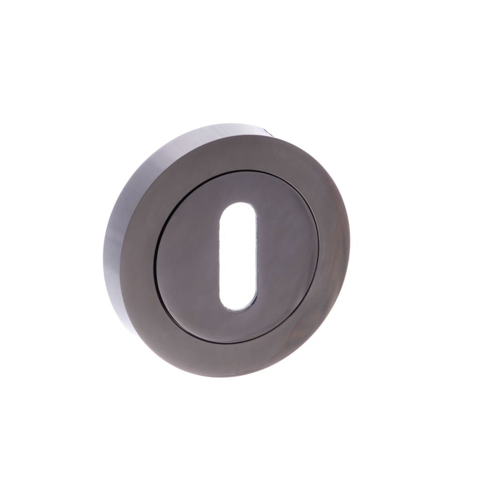 This is an image of STATUS Key Escutcheon on Round Rose - Black Nickel available to order from T.H Wiggans Architectural Ironmongery in Kendal, quick delivery and discounted prices.