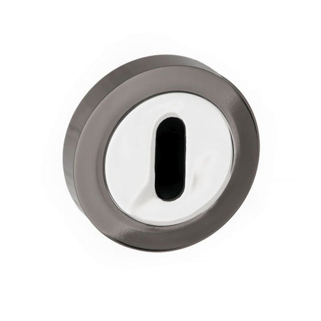 This is an image of STATUS Key Escutcheon on Round Rose - Black Nickel/Polished Chrome available to order from T.H Wiggans Architectural Ironmongery in Kendal, quick delivery and discounted prices.