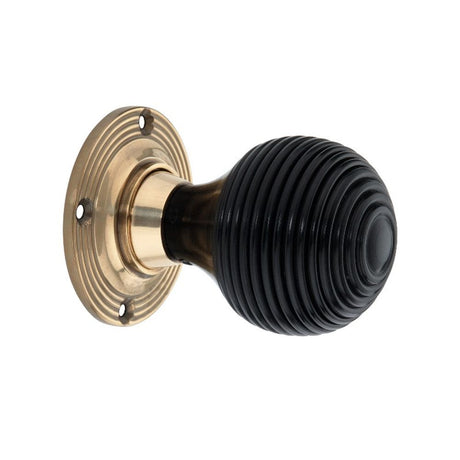 This is an image of Spira Brass - Ebony Beehive Rim/Mortice Door Knob Aged Brass available to order from T.H Wiggans Architectural Ironmongery in Kendal, quick delivery and discounted prices.