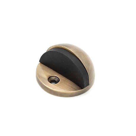 This is an image of Spira Brass - Half Moon Door Stopper Antique Brass available to order from T.H Wiggans Architectural Ironmongery in Kendal, quick delivery and discounted prices.
