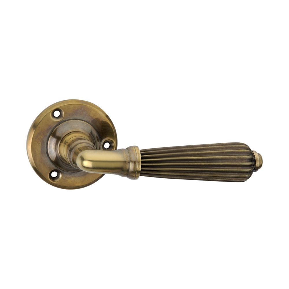 This is an image of Spira Brass - Regency Lever Door Handle Aged Brass available to order from T.H Wiggans Architectural Ironmongery in Kendal, quick delivery and discounted prices.