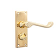This is an image of Spira Brass - Victorian Scroll Privacy Lever Handle 115mm Polished Brass available to order from T.H Wiggans Architectural Ironmongery in Kendal, quick delivery and discounted prices.