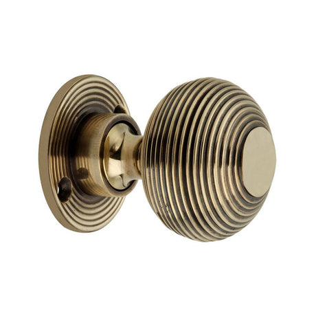 This is an image of Spira Brass - Beehive 50mm Rim/Mortice Door Knob Aged Brass available to order from T.H Wiggans Architectural Ironmongery in Kendal, quick delivery and discounted prices.