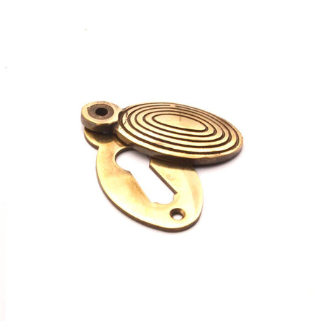 This is an image of Spira Brass - Oval Beehive Escutcheon Aged Brass available to order from T.H Wiggans Architectural Ironmongery in Kendal, quick delivery and discounted prices.