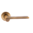This is an image of Senza Pari Darrio Designer Lever on Round Rose - Weathered Antique Bronze available to order from T.H Wiggans Architectural Ironmongery in Kendal, quick delivery and discounted prices.