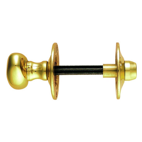 This is an image of a Carlisle Brass - Oval Thumb Turn with Coin Release - Polished Brass that is availble to order from T.H Wiggans Architectural Ironmongery in Kendal.